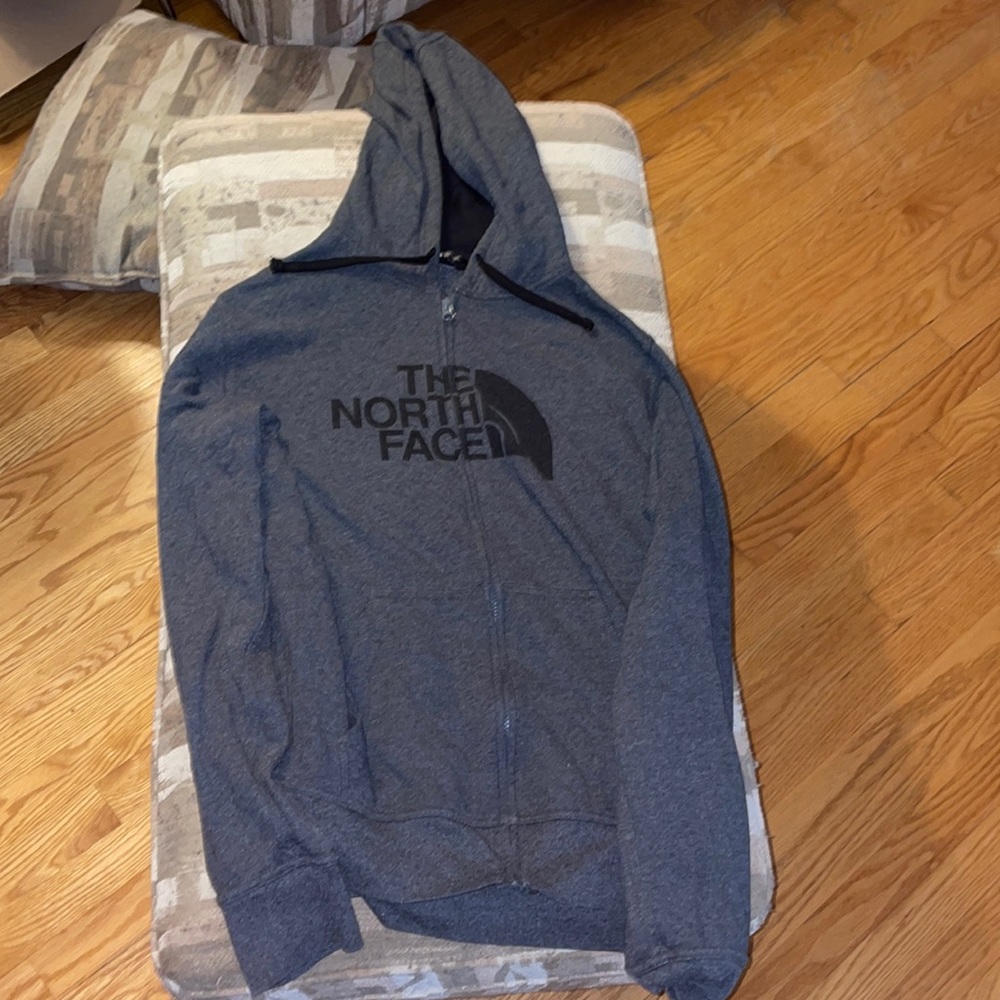 Zip up north face sweater.